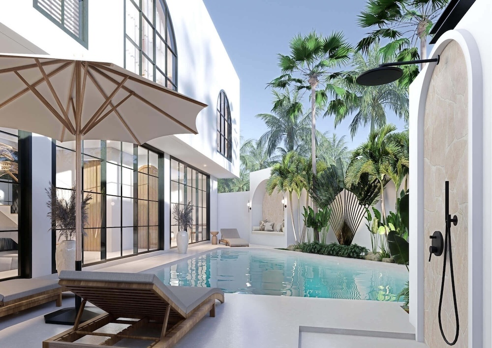Poolside terrace and landscaped courtyard at Mediterranean Villas by Prestige